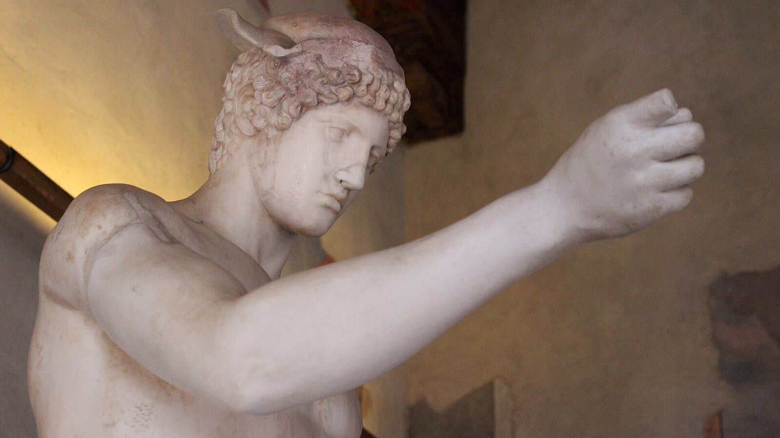 Marble statue of Hermes with a winged cap and an outstretched hand, Palazzo Altemps in Rome
