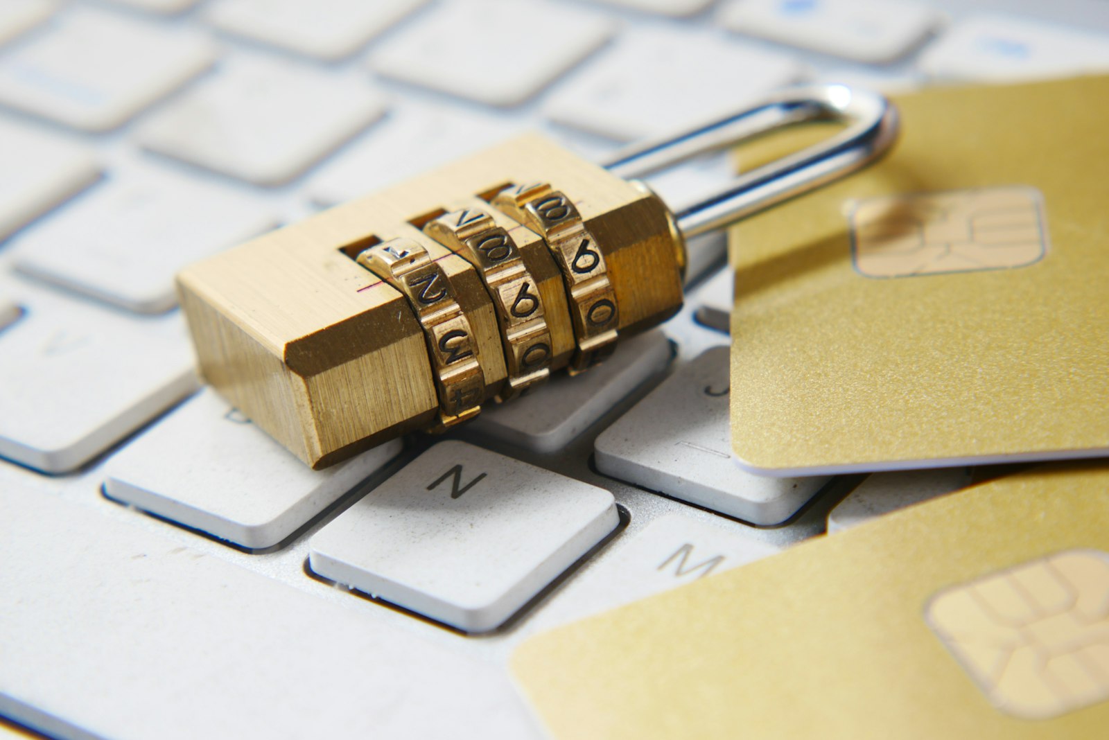 A golden padlock resting on a laptop keyboard — fitting metaphor for a self-hosted password vault.